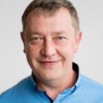 Portrét usmívajícího se muže v modré košili, zástupce ROSPACK Obaly.